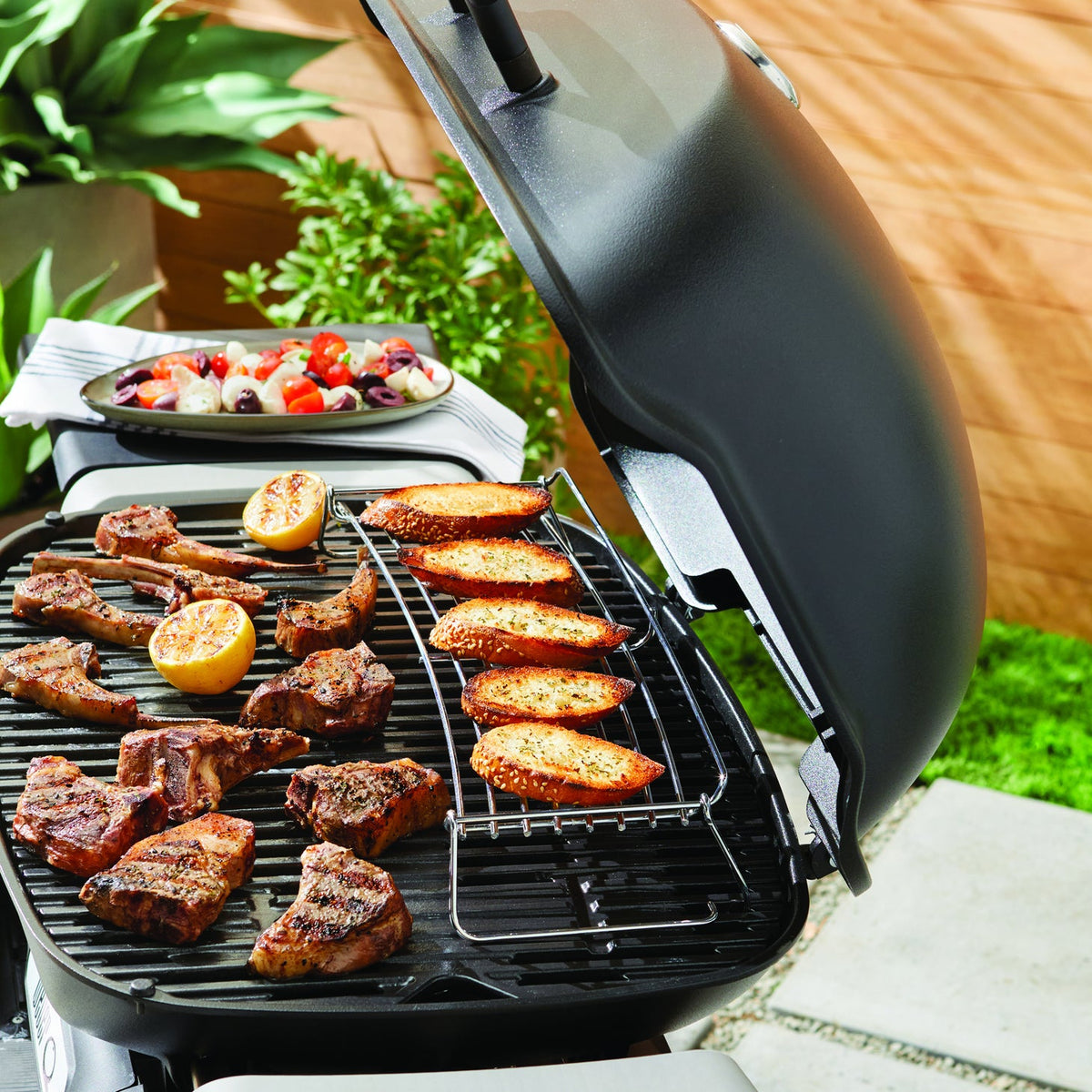 Weber Q Family Q G3 warming rack in use